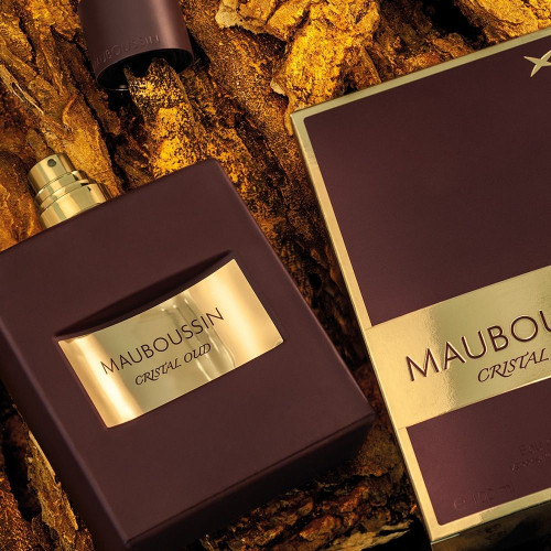 Visuel d'ambiance avec flacon et packaging - Eau de parfum Cristal Oud | MAUBOUSSIN